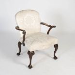 A 19th century mahogany George III style armchair, the floral brocade upholstered back and