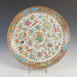 A Chinese porcelain famille rose Canton charger, Qing Dynasty, decorated with birds, butterflies and