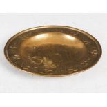 A Keswick Art & Crafts embossed brass dish, stamped marks 'W.H. MAWSON, KESWICK', 21cm diameter.
