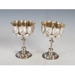 A pair of 18th/ 19th century Germanic white metal goblets, the rounded octagonal shaped bowls with