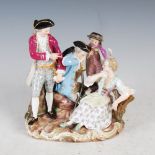 A late 19th/early 20th century Meissen porcelain figure group, modelled with female, boy and two