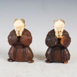 A pair of Japanese ivory and carved wood figures of boys playing, Meiji Period, 8.5cm high.