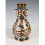 A Chinese cloisonne arrow vase, Qing Dynasty, the white ground decorated with precious objects,