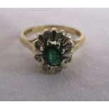 Gold emerald and diamond cluster ring