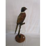 Pheasant on branch sculpture
