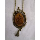 Reverse carved glass pendant with tassel