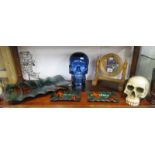 Shelf of collectables to include skulls