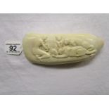 Marine ivory (possibly whale or walrus) carved tusk depicting Orpheus placating the lions with his