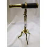 Small brass telescope on tri-pod