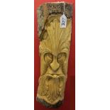 Green man carving sprouting leaves from mouth