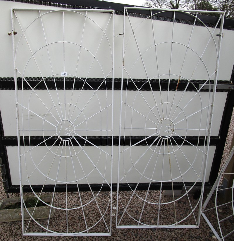 Pair of wrought iron window guards featuring teddy bears