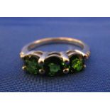 White gold green garnet 3 stone set ring