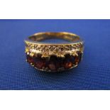 Gold garnet & diamond set ring