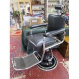 Vintage barber's chair by L A Reine