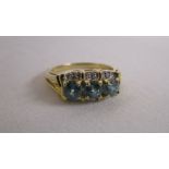 Gold blue topaz & diamond set ring