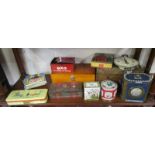 Shelf of vintage advertising tins etc