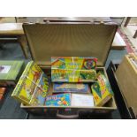 Vintage suitcase containing vintage games