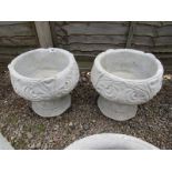 Pair of stone 'Fleur-De-Lys' urns - Urns depicting the stylized 3 petal design