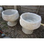 Pair of stone pots on stands