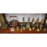 Shelf of collectables to include brass, copper & wooden figures