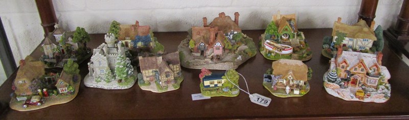 Shelf of boxed Lilliput Lane cottages