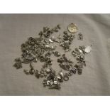 Collection of silver and white metal charms