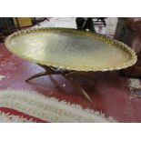 Large oval brass top coffee table