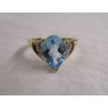 Gold blue topaz and diamond set ring