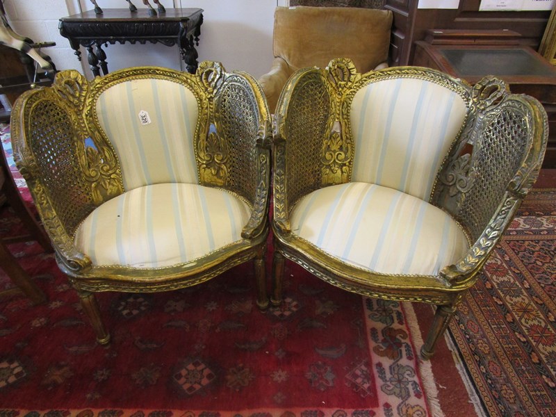 Pair of French gilt and bergère tub chairs
