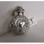 Hallmarked silver bottle case containing green glass bottle