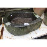 Small stone horseshoe trough