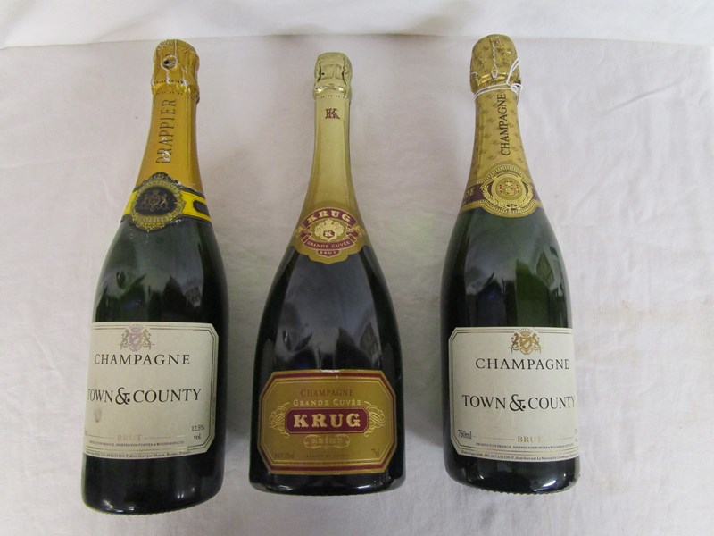 3 bottles of champagne to include 1 bottle of Krug
