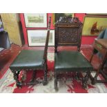 Pair of carved oak Armorial chairs