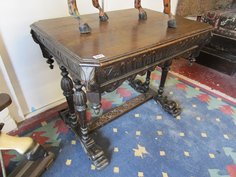 Carved oak centre table - H: 76cm W: 91cm D: 65cm