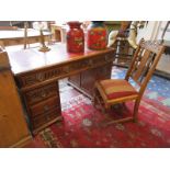 Fine quality oak pedestal desk ( H: 80cm W: 137cm D: 77cm) with red leather top and matching chair