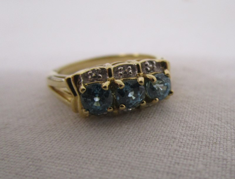 Gold blue topaz & diamond ring