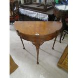 Mahogany demi lune card table on cabriole legs