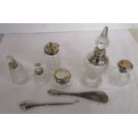 Collection of silver topped glass bottles together with silver handled button hook & shoe horn
