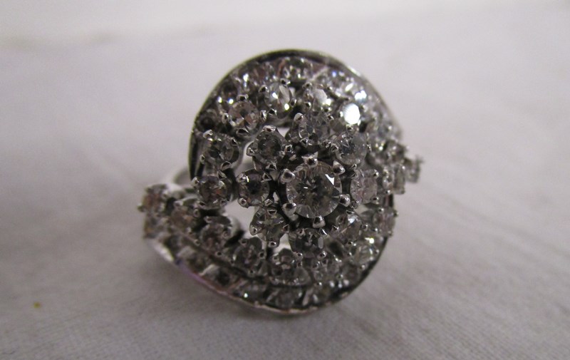 Large & unusual diamond set swirl ring - Estimate £600 - £900