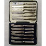 2 sets of silver handled knives