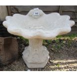 Shell shaped stone bird bath