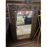 Carved framed mirror