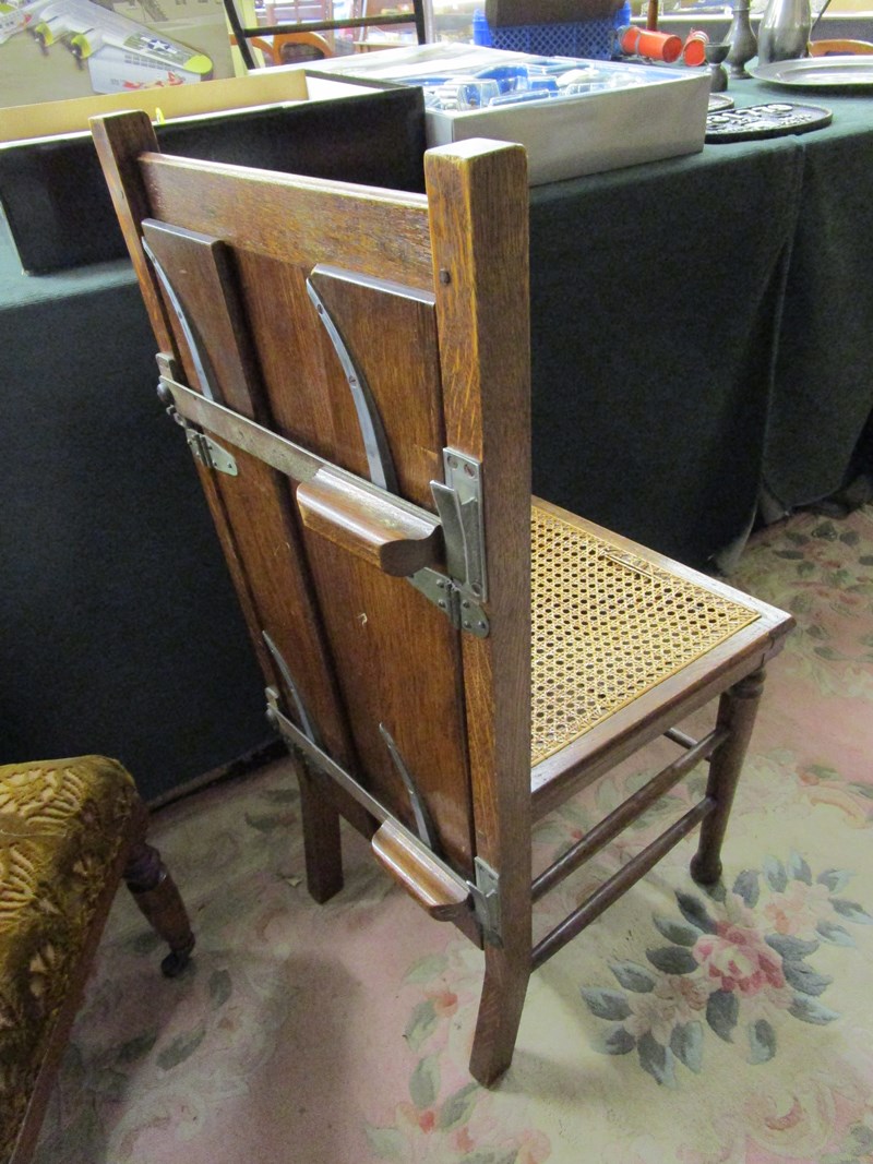 Unusual cane seated chair with trouser press to rear