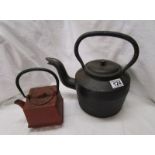 2 heavy cast teapots