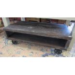 Unusual rustic coffee table on wheels