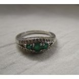 White gold emerald and diamond set ring