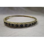 Gold sapphire and diamond bangle