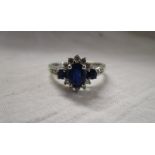 White gold sapphire and diamond cluster ring