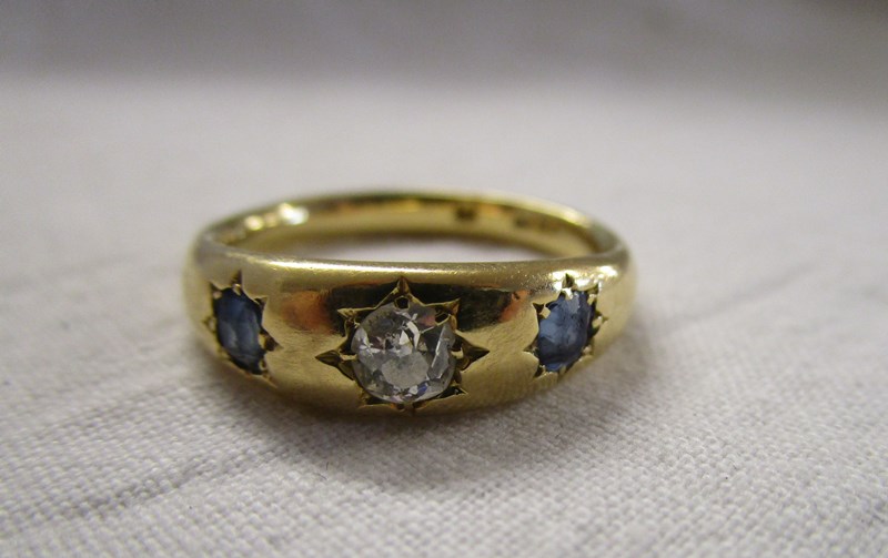 18ct gold sapphire and diamond gypsy set ring