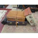 4 vintage suitcases